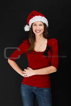 Beautiful woman wearing a santa hat