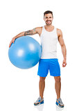 Athletic man with a pillates ball