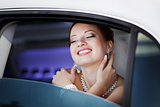 Lovely red hair bride in limo.