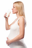 Pregnant woman drinking milk 