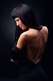 Beautiful elegant woman in black dress indoors