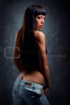 Young sensual woman in jeans