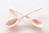 Empty spoons on brown background