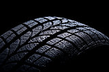 Car tire isolated on black background