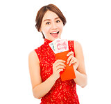 happy  asian woman holding a red envelope with money