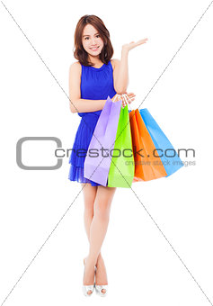 beautiful young woman with shopping bags. isolated on white