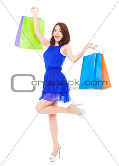 asian young woman with shopping bags. isolated on white