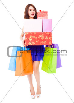 pretty woman holding shopping bags and gift boxes 