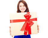 closeup of happy young woman holding a gift box