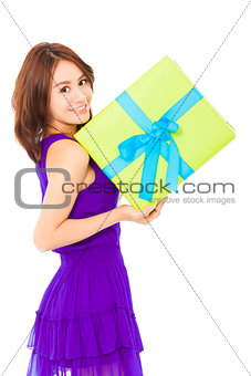 beautiful young woman holding a gift box