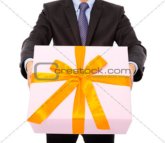 Businessman holding a gift box. isolated on white
