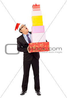 businessman holding some gift boxes. isolated on white