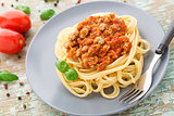 Spaghetti bolognese with basil leave