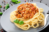 Spaghetti bolognese with basil leave
