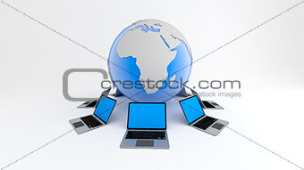 Laptops around globe. Global network concept.