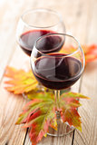 Red wine and autumn leaves.