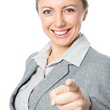 Portrait of young business woman pointing finger at viewer