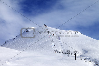 Ski slope and chair-lift at morning