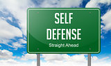 Self Defense on Highway Signpost.