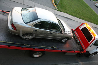 Car on a flatbed truck