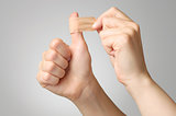 Woman with a plaster on her thumb
