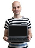 man holding a computer and displaying the screen