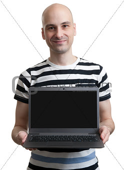 man holding a computer and displaying the screen