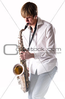 Young man with saxophone over white background