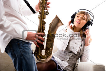 Lovely girl in headphones listening music