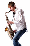 Young man with saxophone over white background 