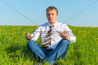businessman relaxing relieves stress in the field