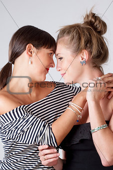 Two Young Female Friends Embracing 
