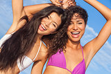 Two Beautiful Women In Bikinis Dancing on Sunny Beach