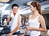 man and woman on treadmill