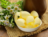 fresh yellow dairy butter in a white bowl