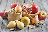 Pears and apples with fall leaves