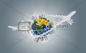 Earth with buildings on surface. Airplanes and network icons