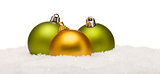 Green and Yellow Christmas Ornaments on Snow Isolated on White