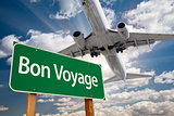 Bon Voyage Green Road Sign and Airplane Above