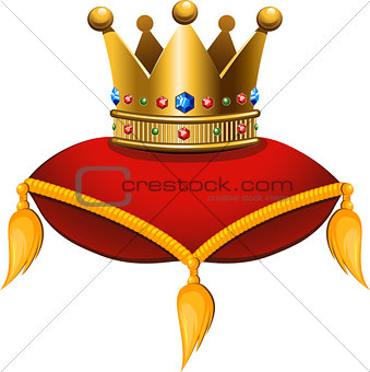 Gold crown on a crimson cushion