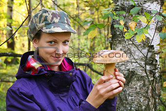 girl collect cep boletus on forest