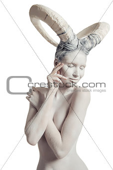 Female with goat body-art isolated on white