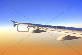Wing of aircraft in sunrise light