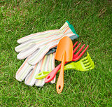 Garden tools over green grass