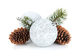 Silver christmas baubles and fir tree