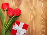 Fresh tulips and gift box