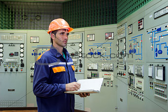 Engineer with a log on the main control panel