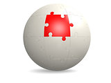 White round puzzle with red
