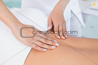 Close up of back massage at spa center