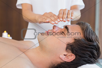 Man receiving treatment at spa center